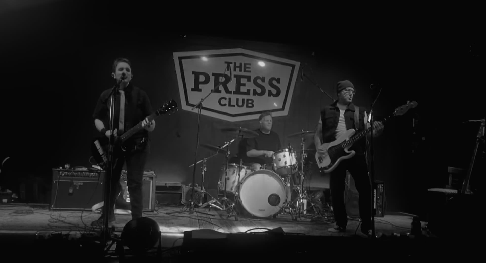Picture of Mark playing bass in a band at the Press Club in Sacramento